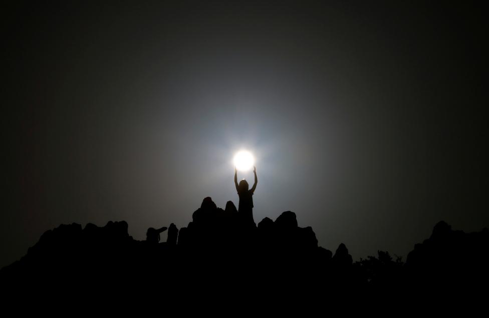 People celebrate the summer solstice at the Kokino megalithic observatory near the city of Kumanovo